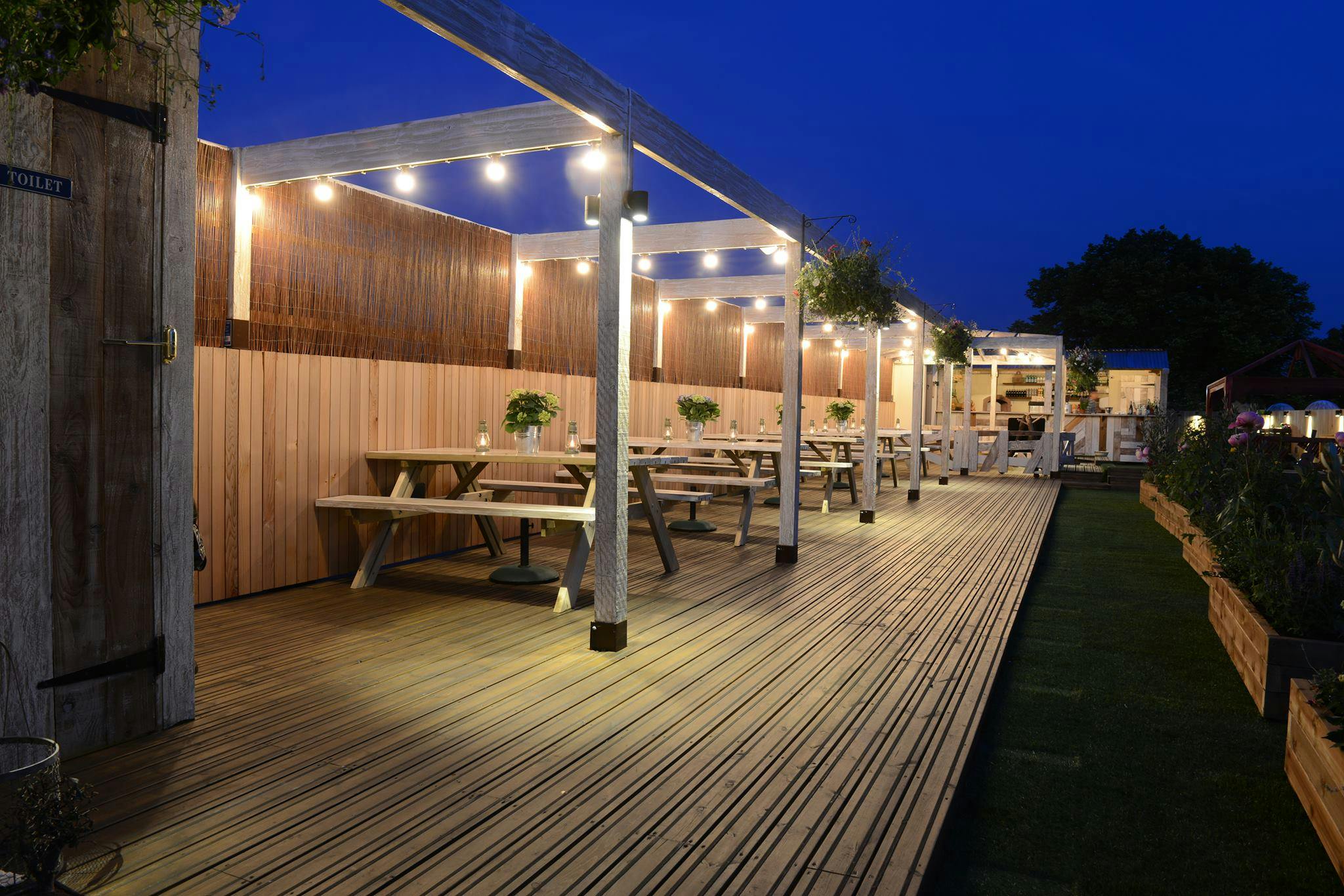 Chiswick Roof Terrace with wooden decking, perfect for summer events and networking.