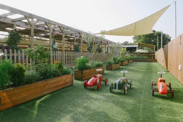 Chiswick Roof Terrace with lush greenery, perfect for family-friendly events and gatherings.