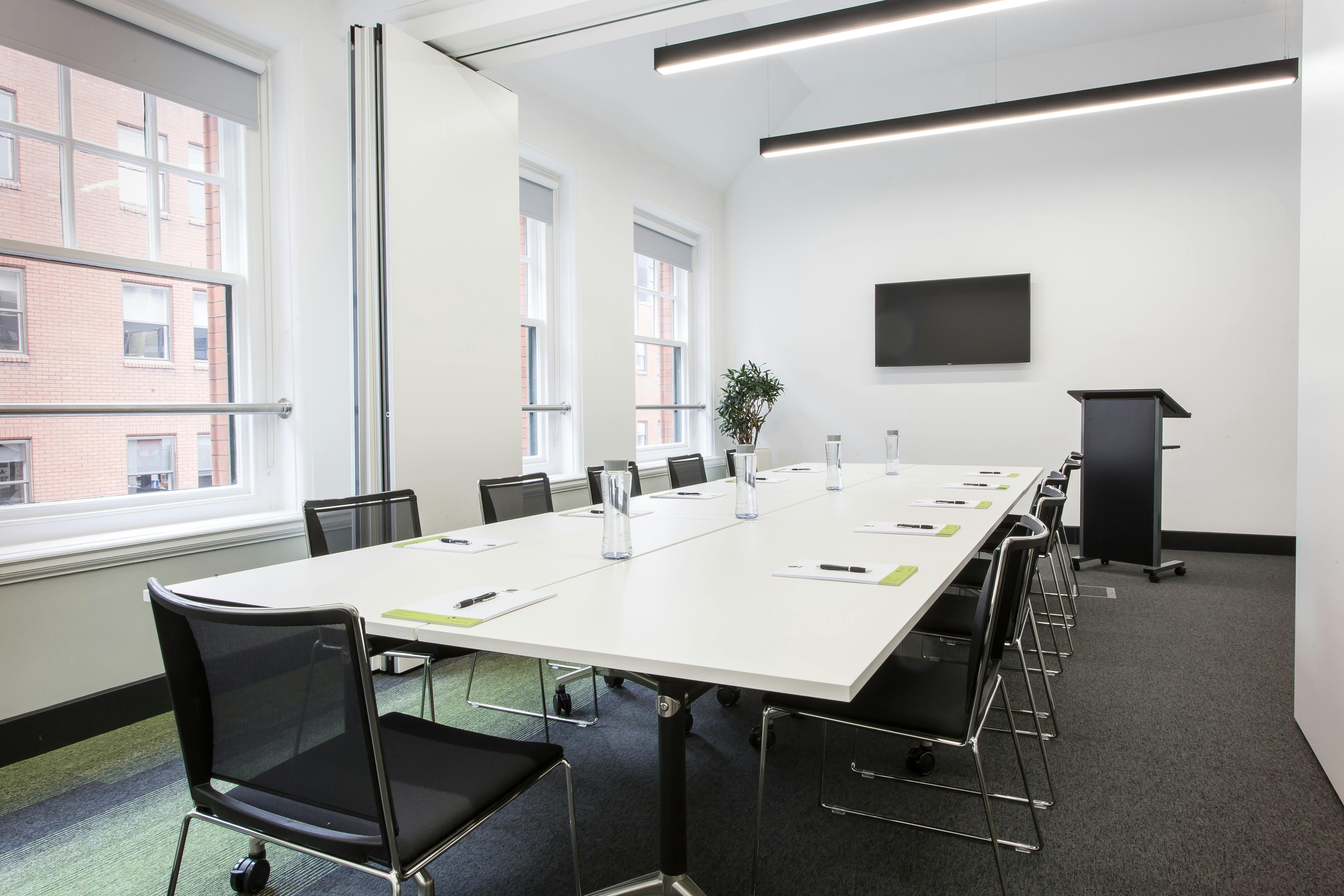 Modern Gaskell Room with sleek table setup for professional meetings and presentations.