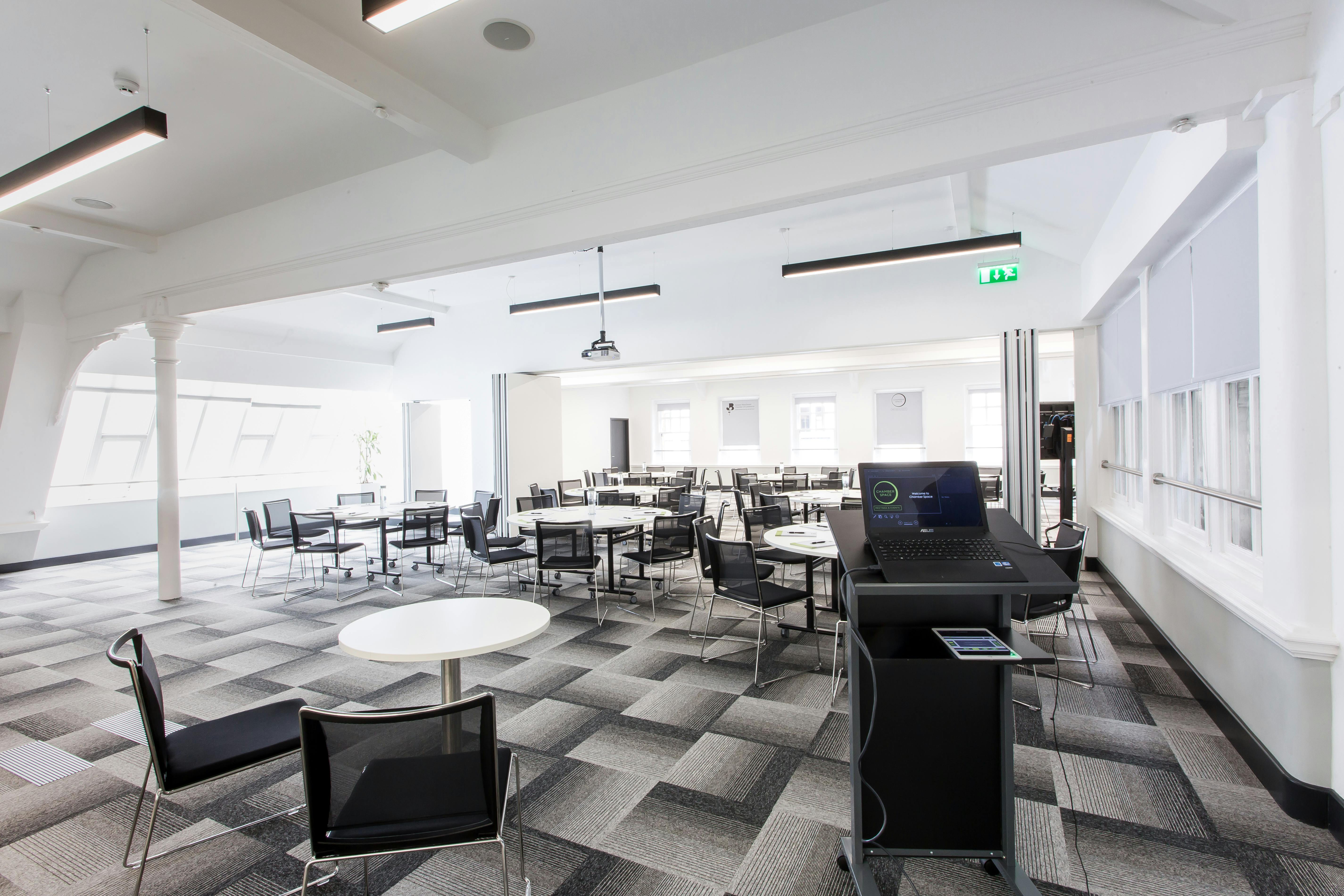 Elliot Suite: modern event space with modular seating for meetings and gatherings.