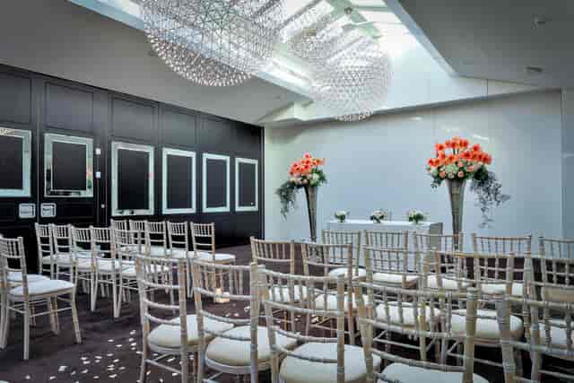Weddings in elegant Penthouse State Rooms with chandeliers and floral arrangements.