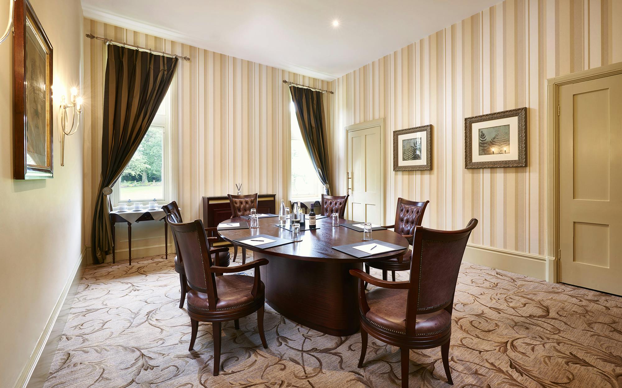 Sycamore Room at Rockliffe Hall: elegant meeting space with plush seating for gatherings.