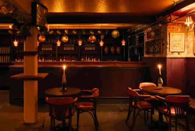 Basement event space at The White Haus with warm lighting for networking and intimate gatherings.