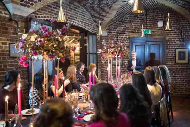 Elegant dining table with floral centerpieces at Café Duke, perfect for corporate events.