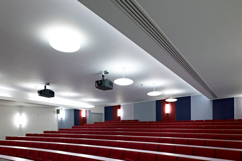 Modern auditorium with tiered seating for meetings and events at ARU Venue Hire, Cambridge.