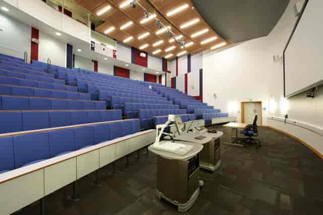 Modern lecture hall with tiered seating for conferences and educational events.