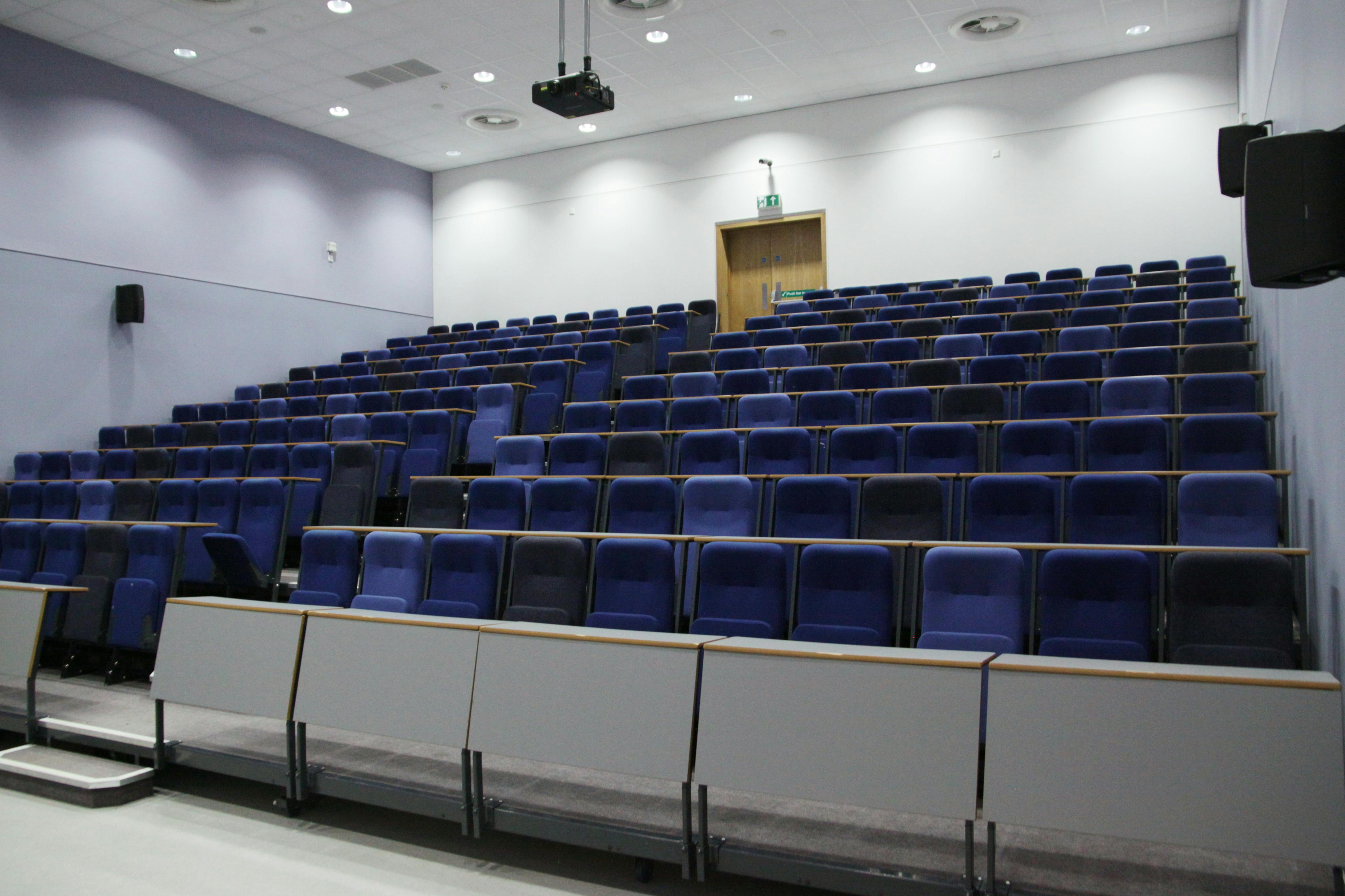 Modern auditorium with tiered seating at ARU Venue Hire, perfect for presentations and lectures.