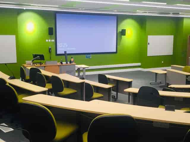 Modern meeting room with tiered seating for presentations at ARU Venue Hire, Chelmsford.