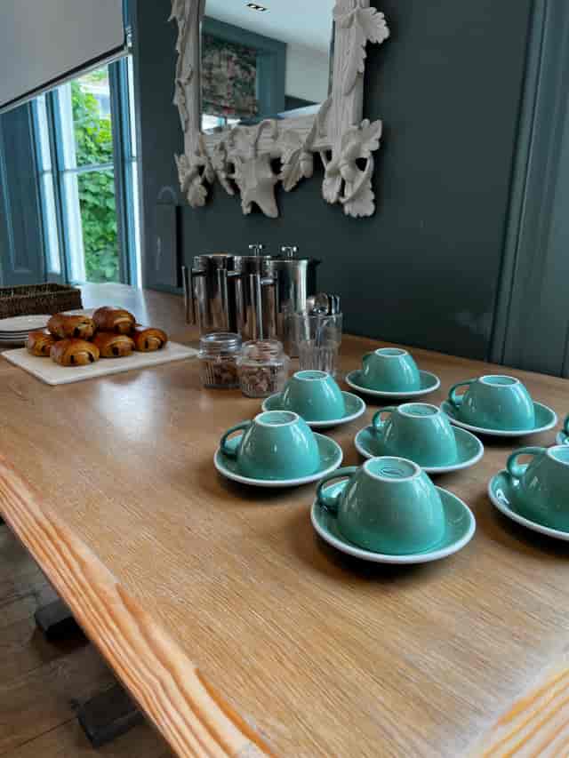 Refreshment station in The Oakley Room, featuring turquoise cups for meetings and events.