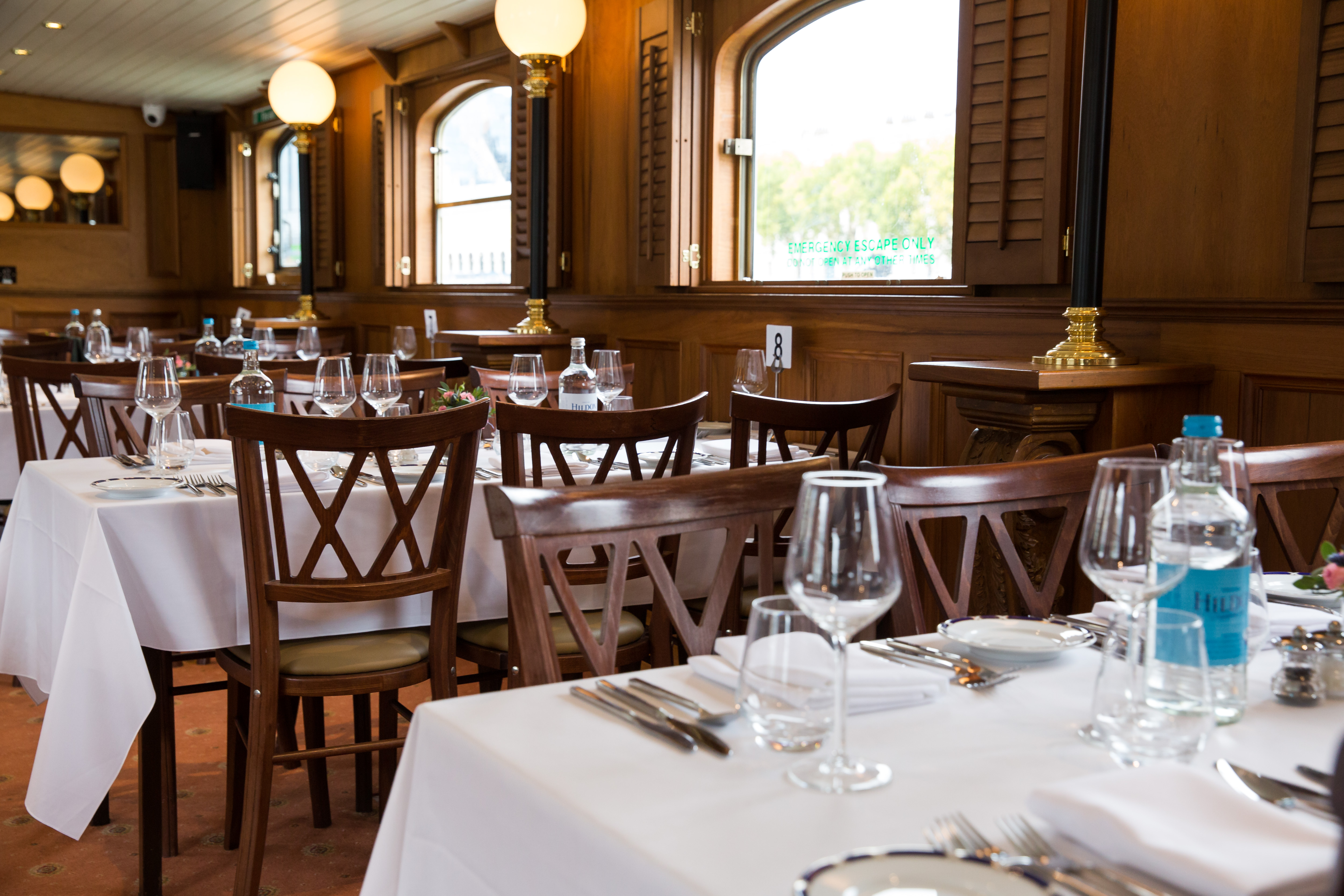 Elegant Edwardian dining venue with warm decor, perfect for intimate events and gatherings.