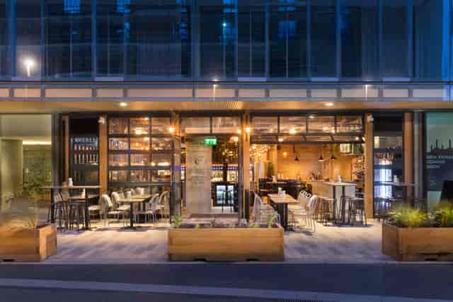 Modern Urban Winery at Battersea Power Station with inviting glass windows for events.