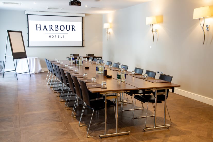 Harbour Suite 1 meeting room with conference table, ideal for corporate events and workshops.