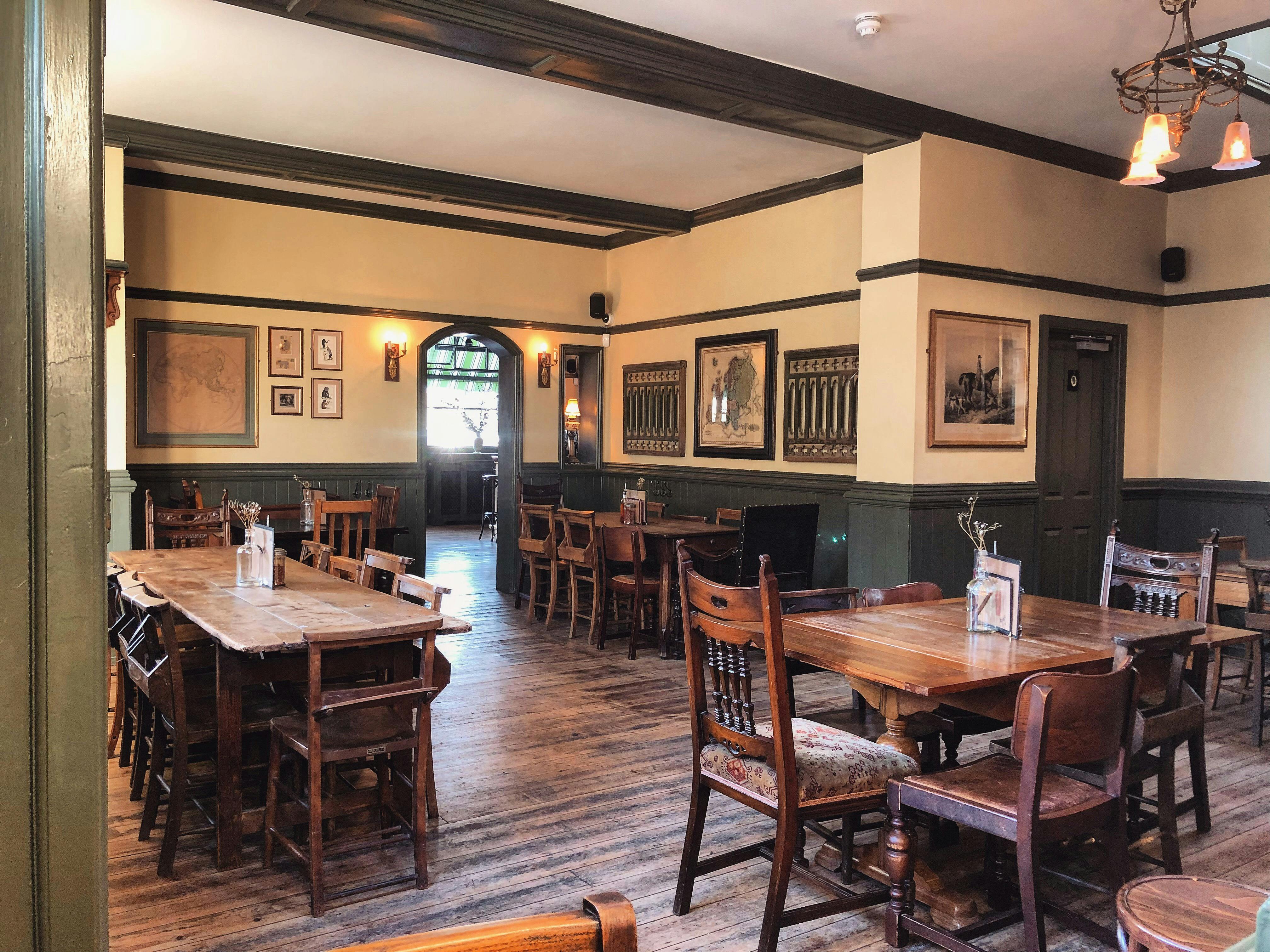 Cozy rustic venue for intimate gatherings with warm wood tones and vintage decor.