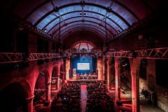Roxy Central event space with audience engaged in a corporate presentation.