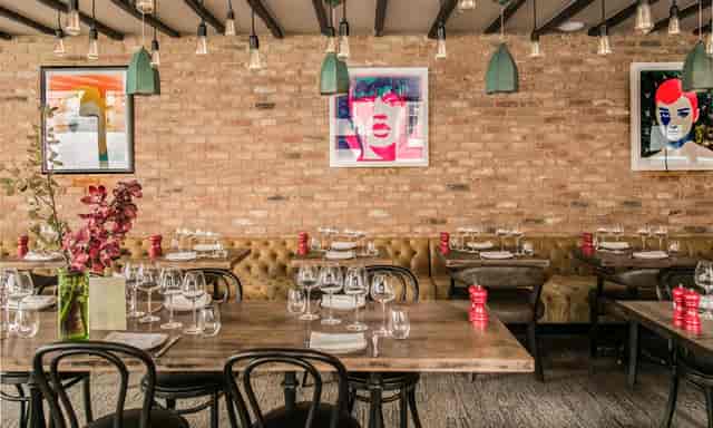 Wilfred's Lounge in Mayfair: stylish restaurant with elegant table settings for events.