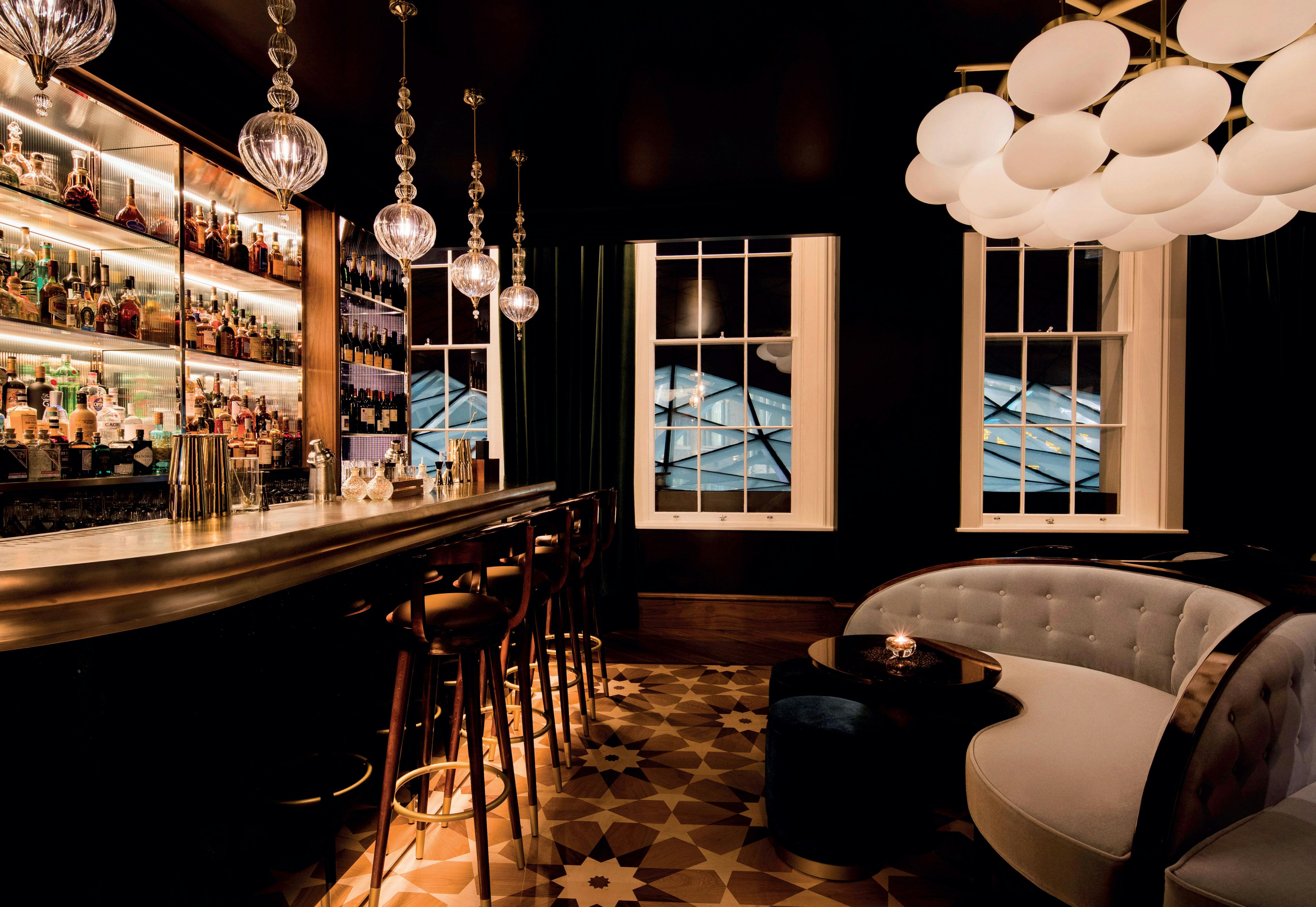 Sophisticated bar venue with elegant lighting for networking events and cocktail receptions.