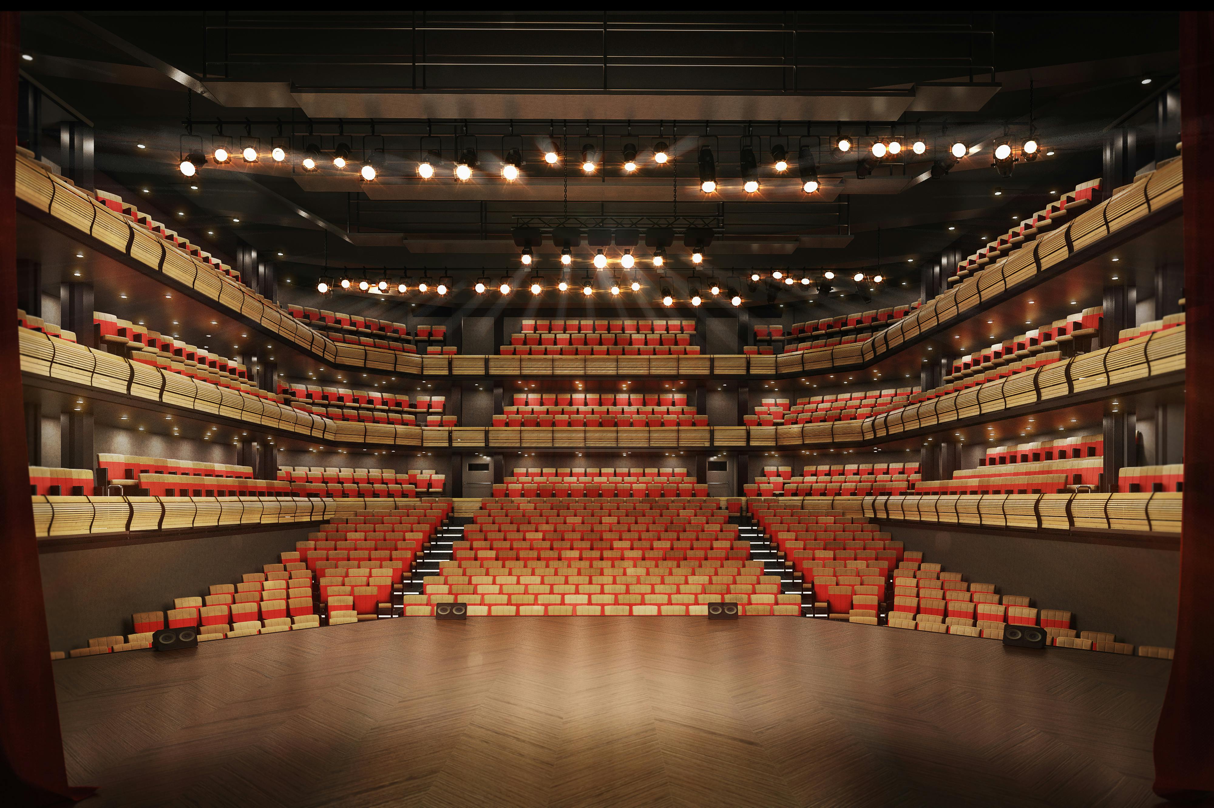 Bridge Theatre auditorium with tiered seating, ideal for conferences and performances.