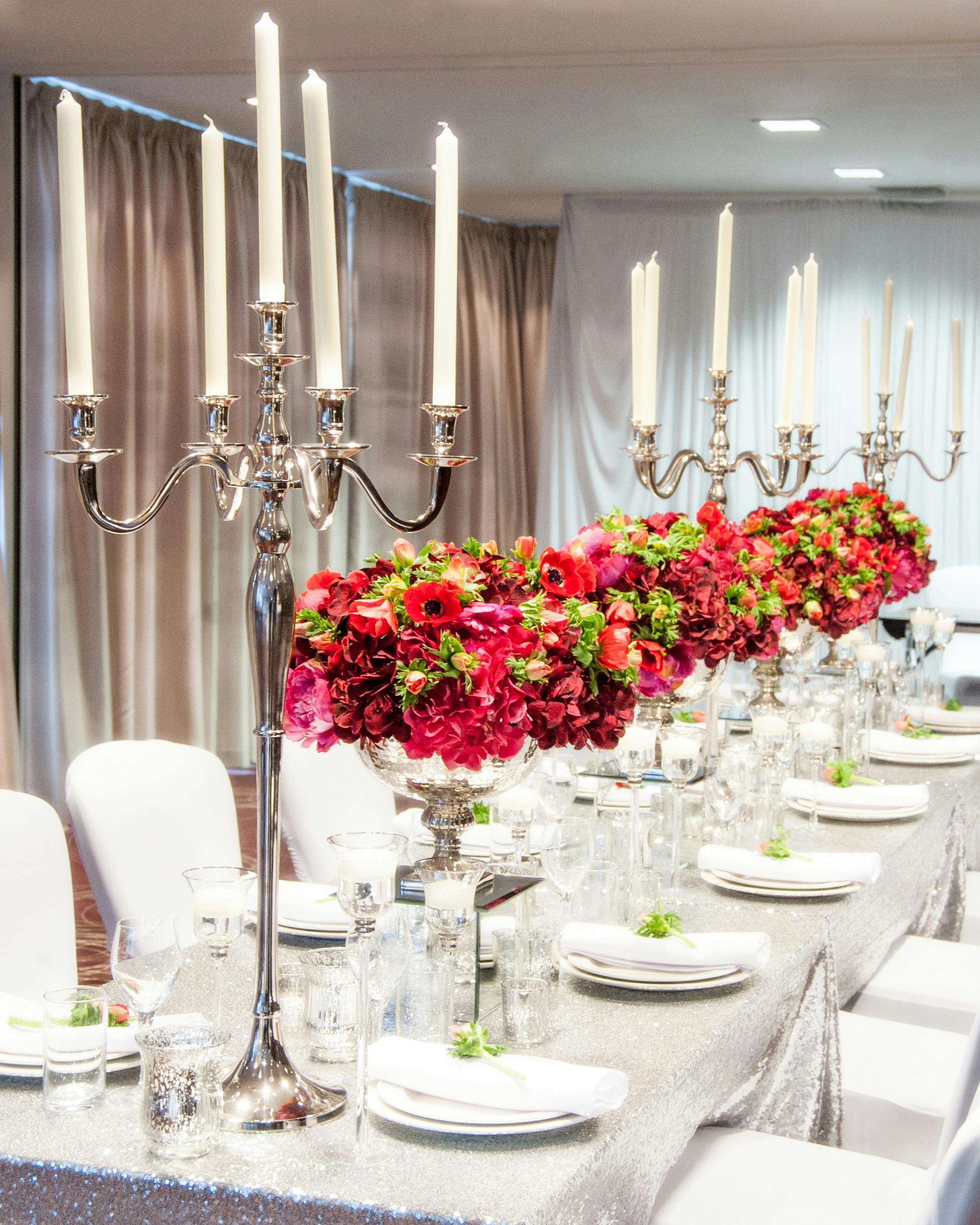 Elegant dining table with floral arrangements for weddings and corporate events.