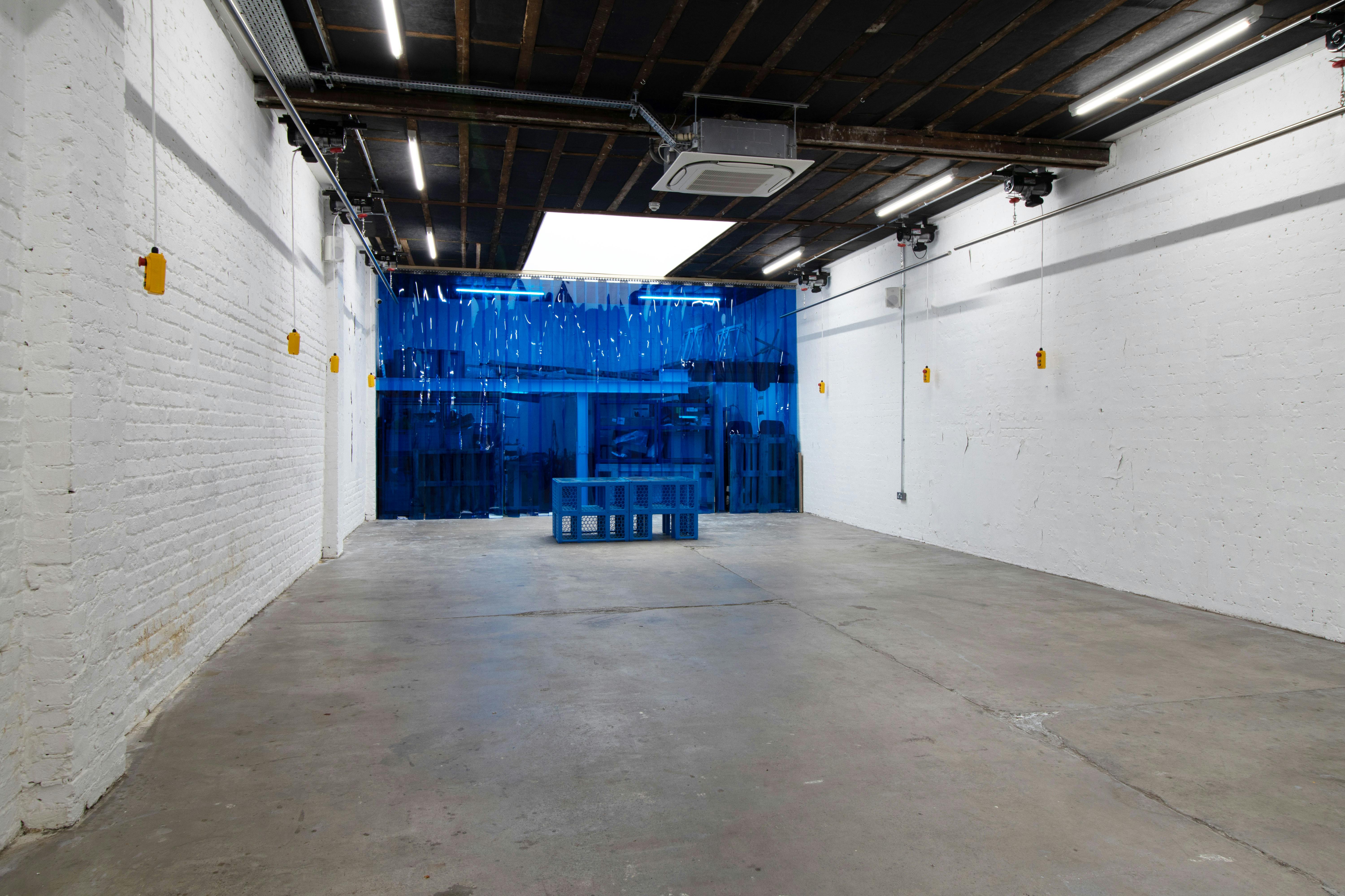 Versatile event space with exposed brick, ideal for networking and presentations near Victoria.