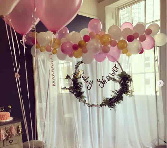 Baby shower event space with balloon arch in The Lillie Lounge, elegant decor.