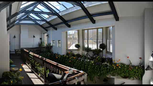Bright Walrus Club Room with large windows, perfect for corporate events and social gatherings.