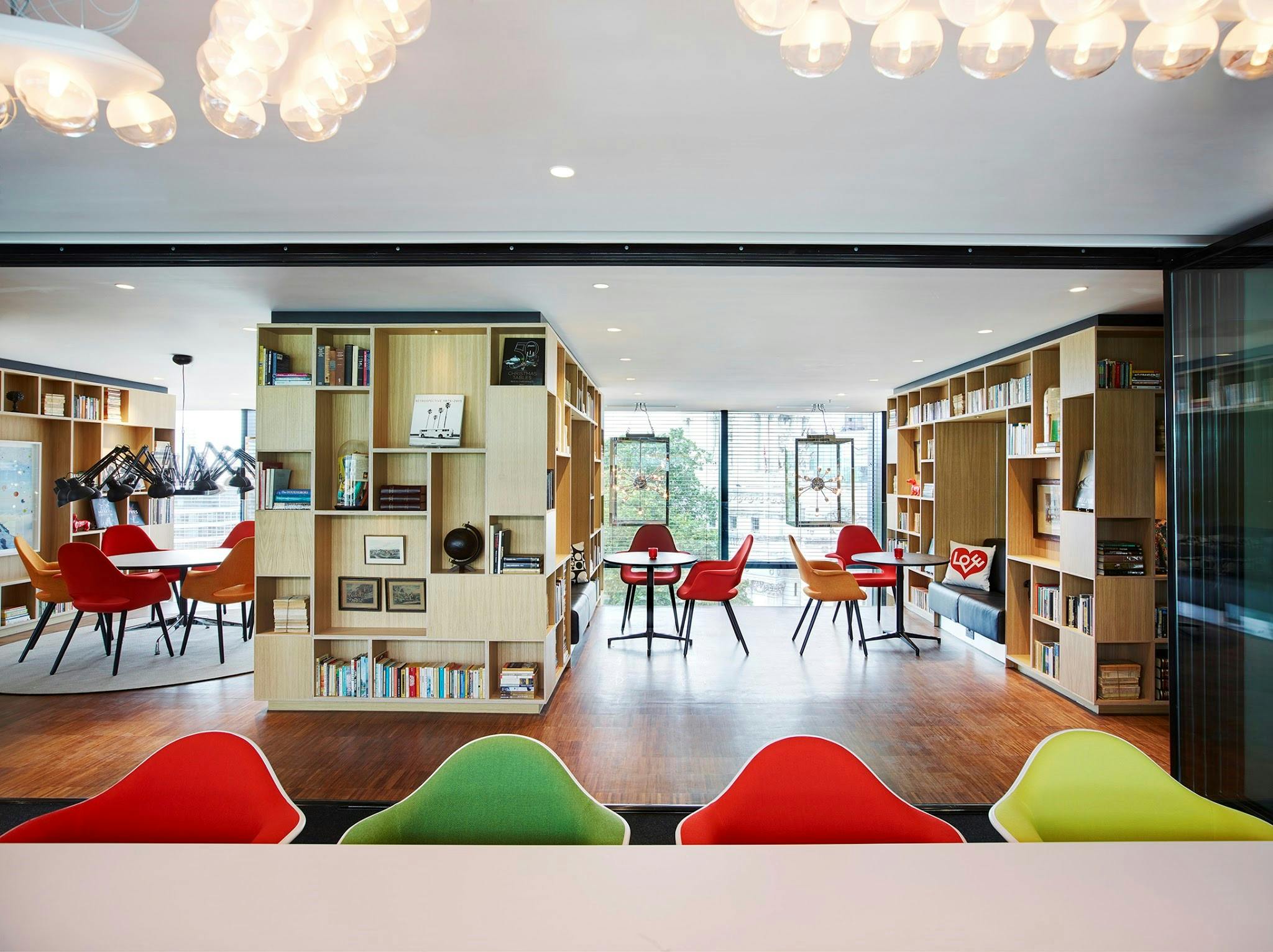 Modern meeting space in cloudM Tower, London, with colorful chairs for workshops.