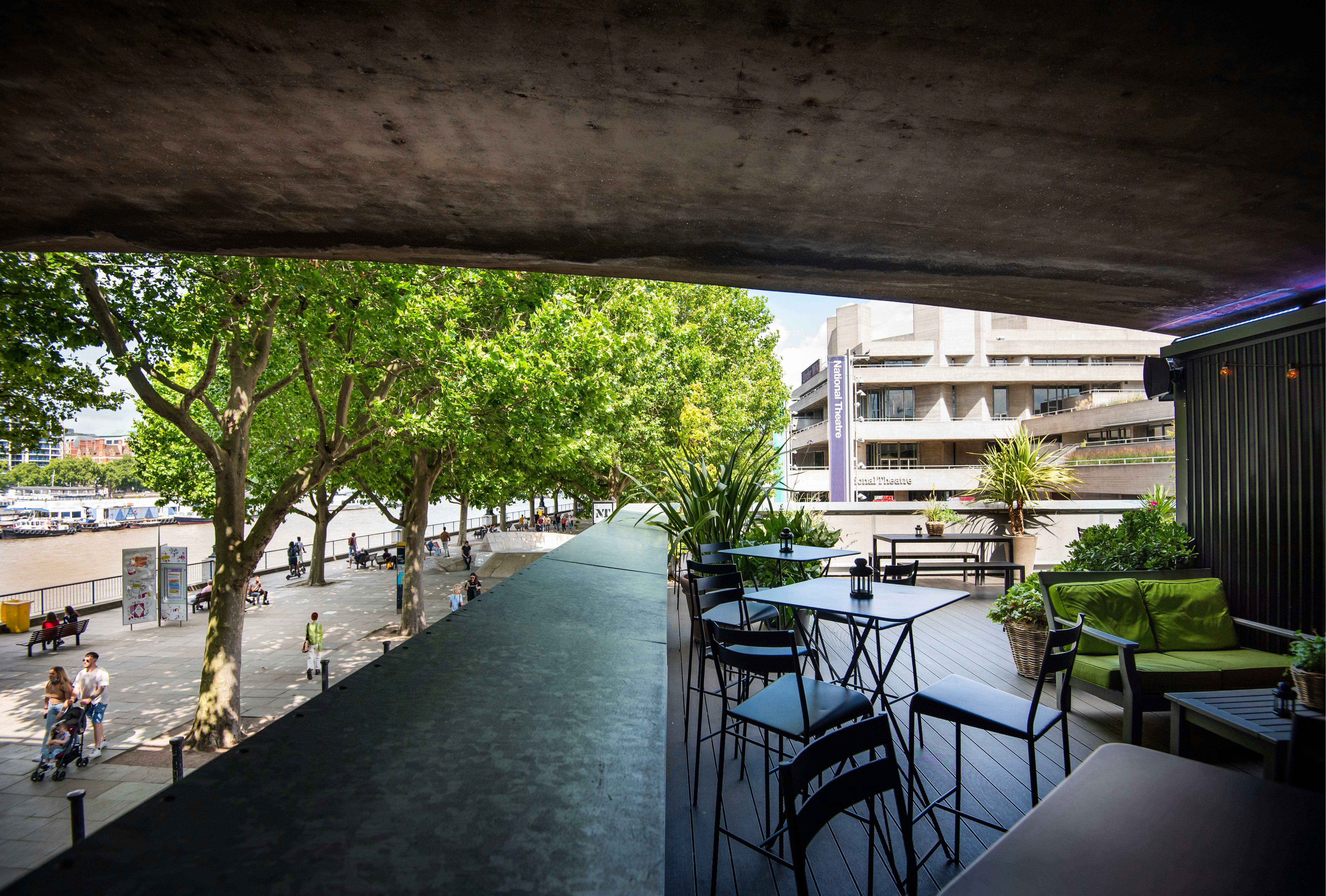 Stylish outdoor Balcony Bar venue with modern seating for networking events and gatherings.