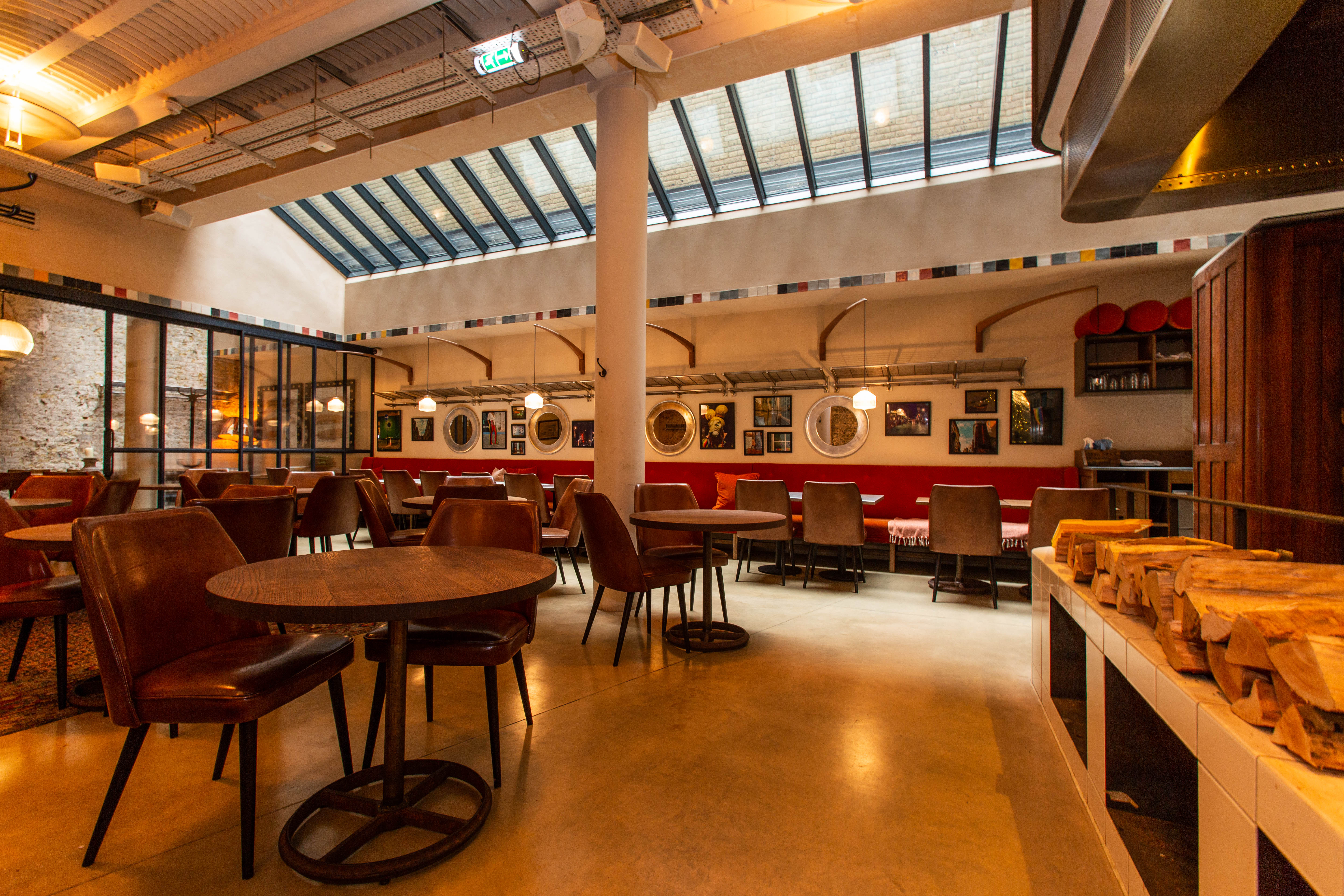 Stylish event space at Sophie's Bar with natural light, ideal for networking and meetings.