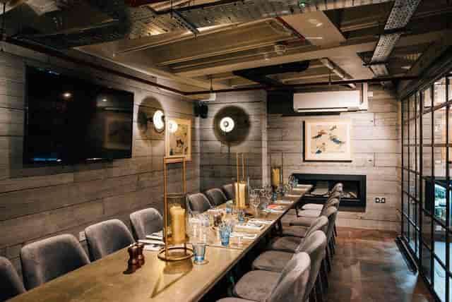 Industrial-chic private dining room at The White Haus for executive dinners and networking events.
