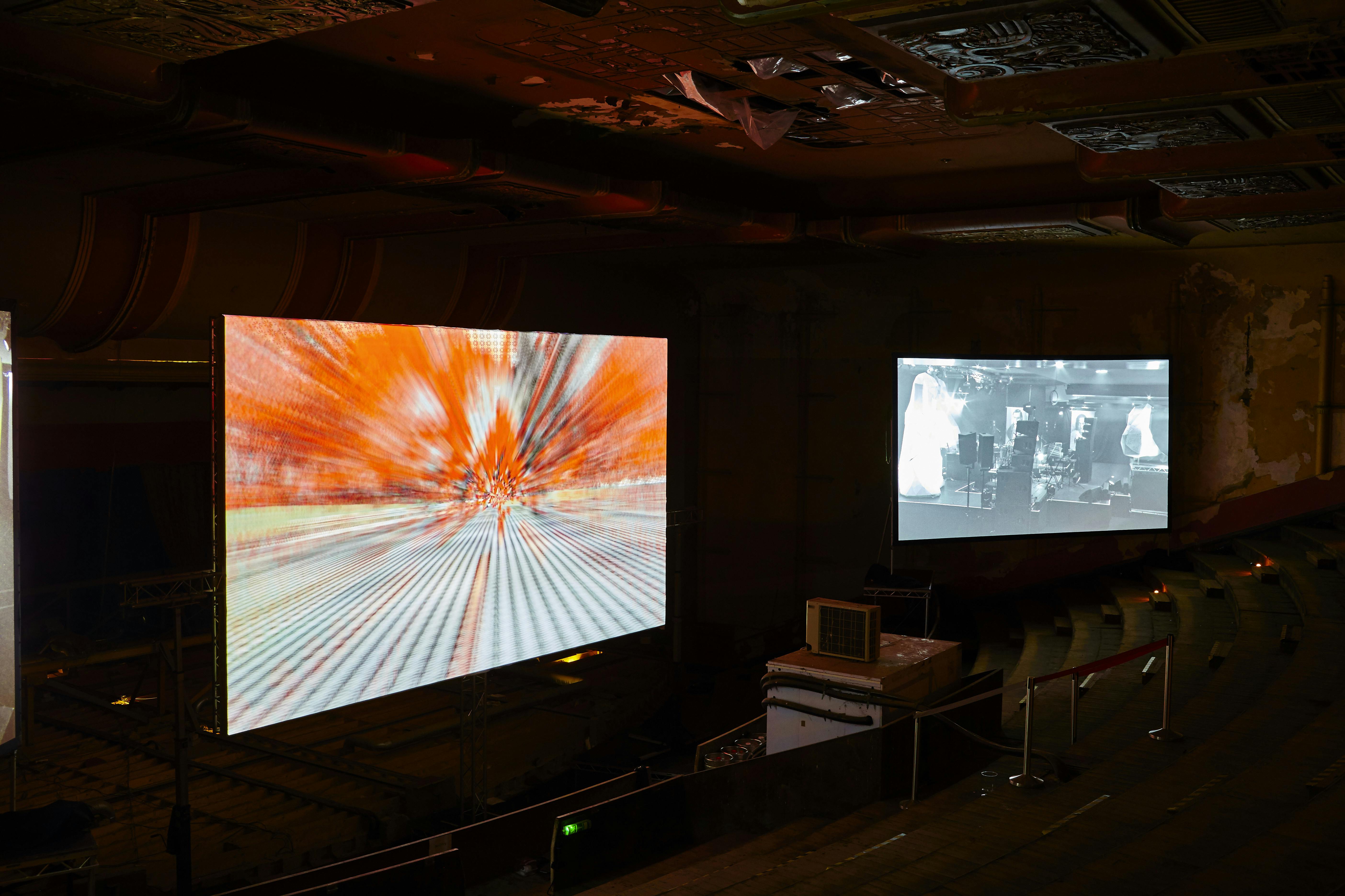 Dynamic Theatre in EartH with large screens for engaging multimedia events.