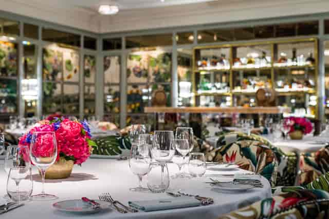 Elegant dining room with floral decor, perfect for upscale events and corporate dinners.