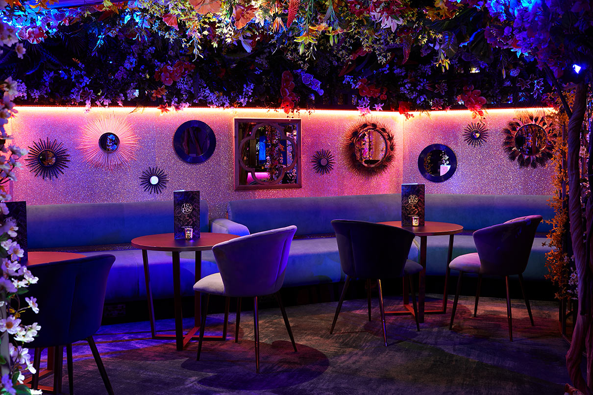 Vibrant event space in Le Jardin, Le Fez with floral decor for networking and gatherings.