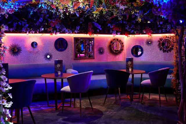 Vibrant event space in Le Jardin, Le Fez with floral decor for networking and gatherings.