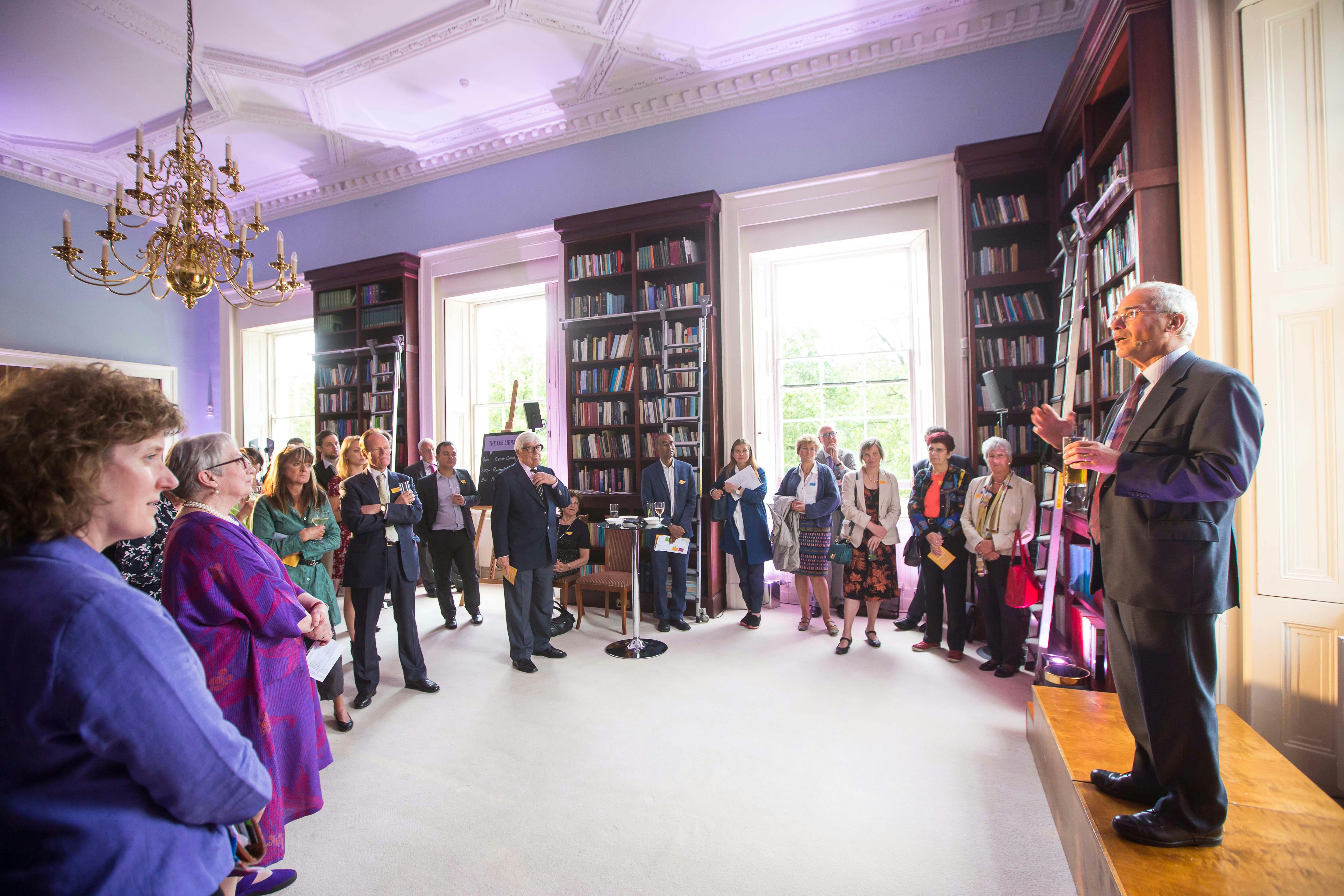 Elegant library event at Carlton House Terrace with warm lighting and networking opportunities.