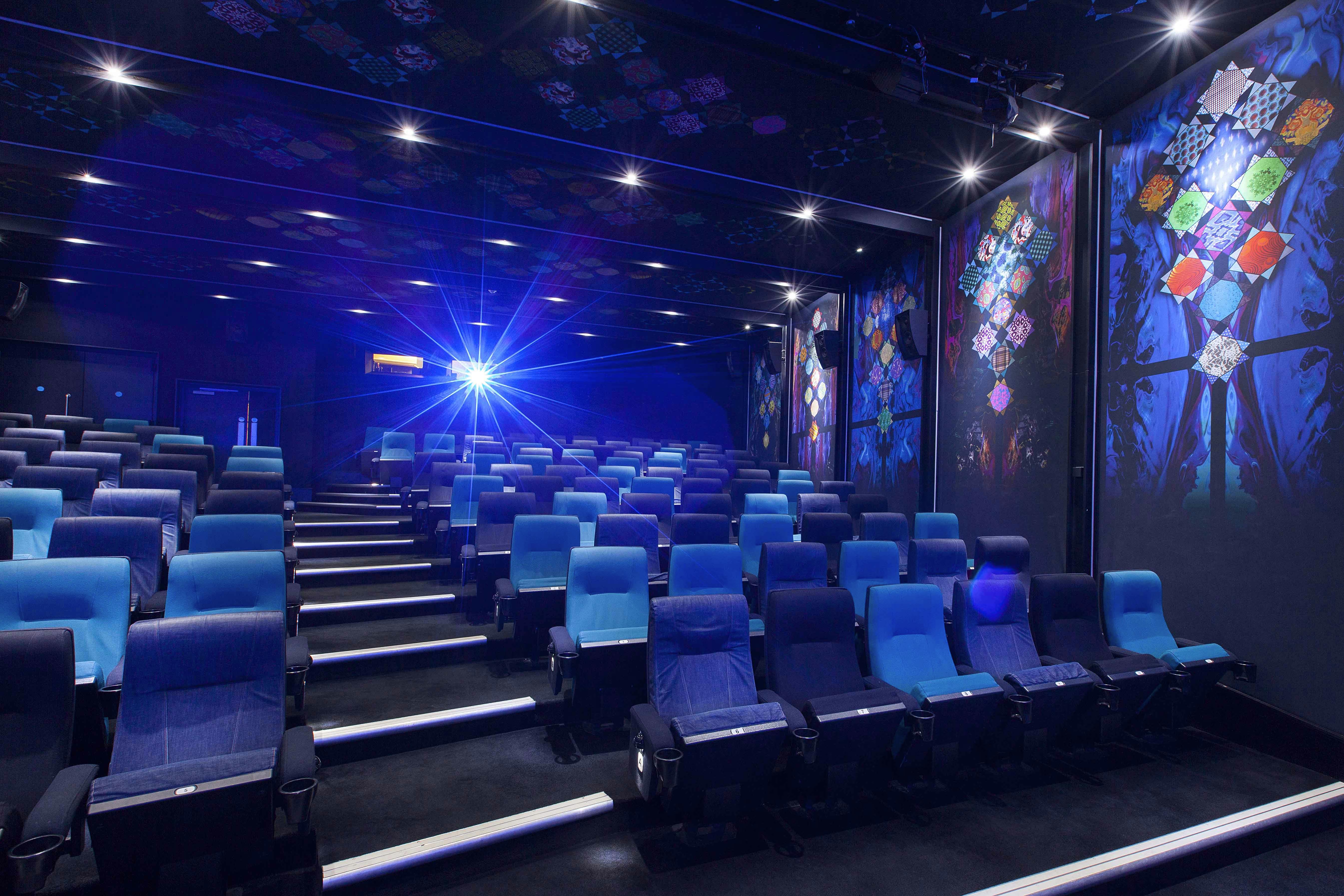 Modern auditorium with tiered seating for conferences and film screenings at Rich Mix.