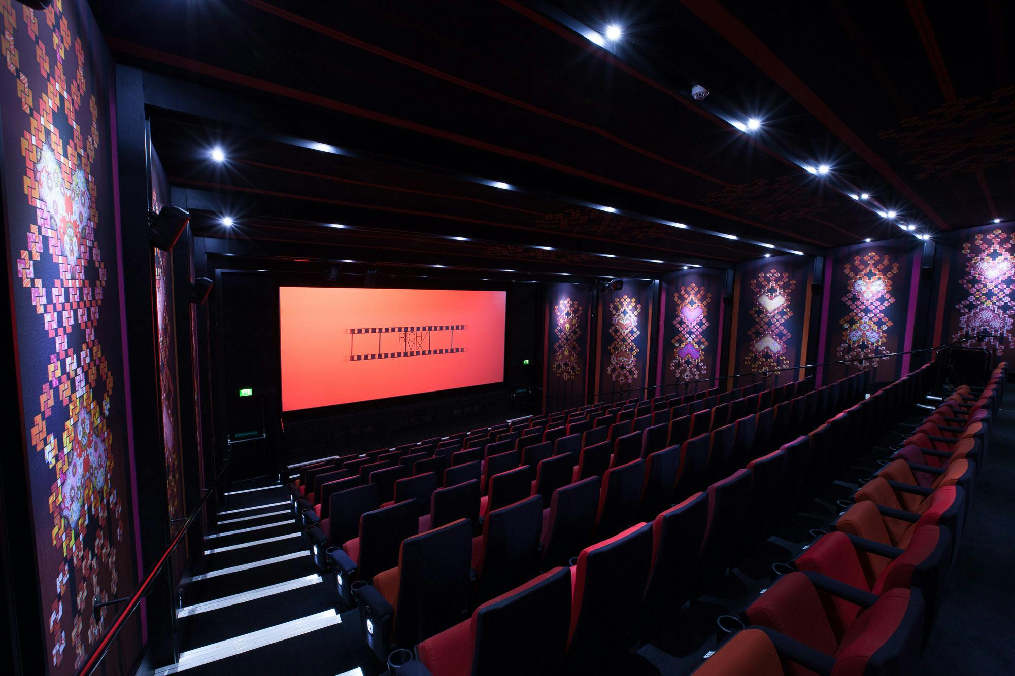 Modern auditorium with spacious seating for corporate events and film premieres.