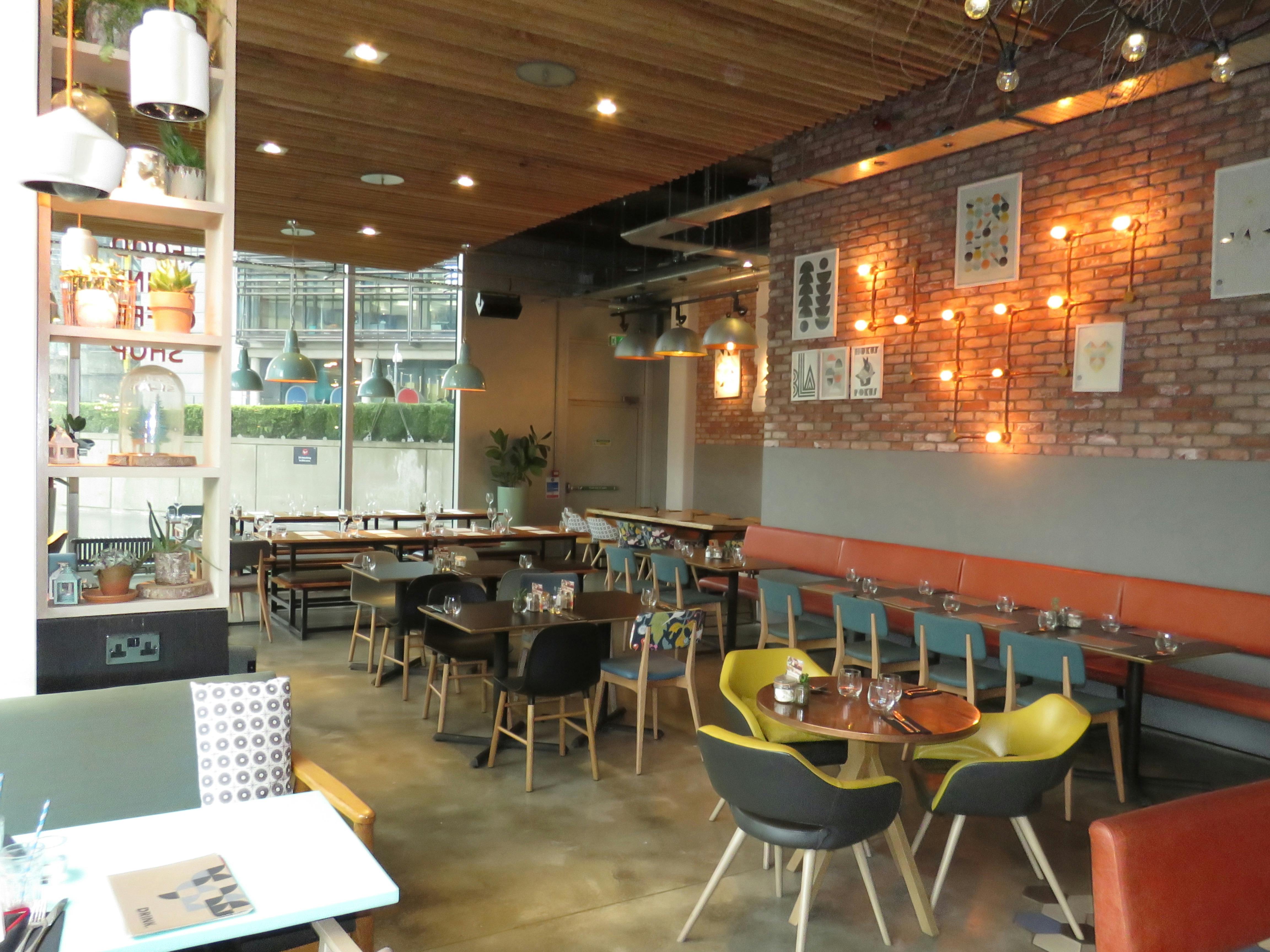 Modern restaurant venue with warm lighting, perfect for meetings and events in KuPP.