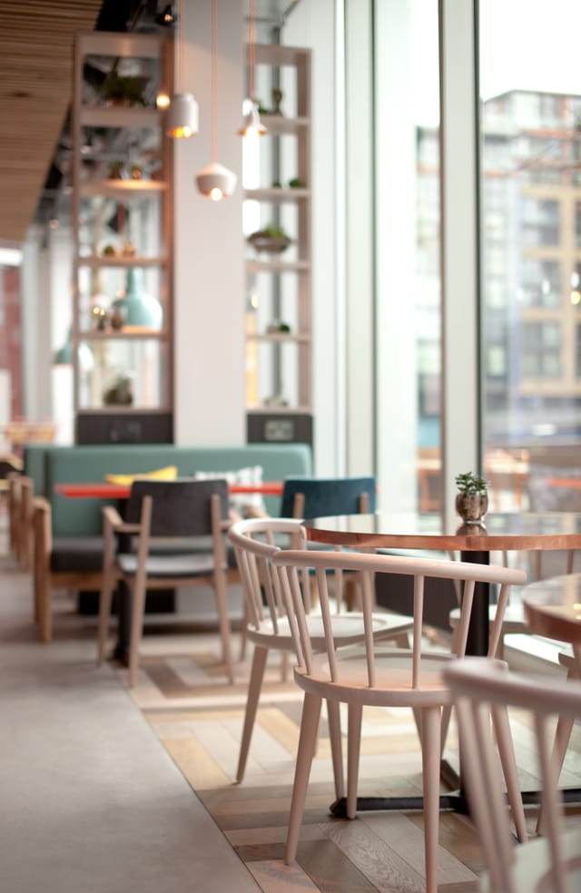 Modern meeting space at KuPP with natural light, ideal for networking events.
