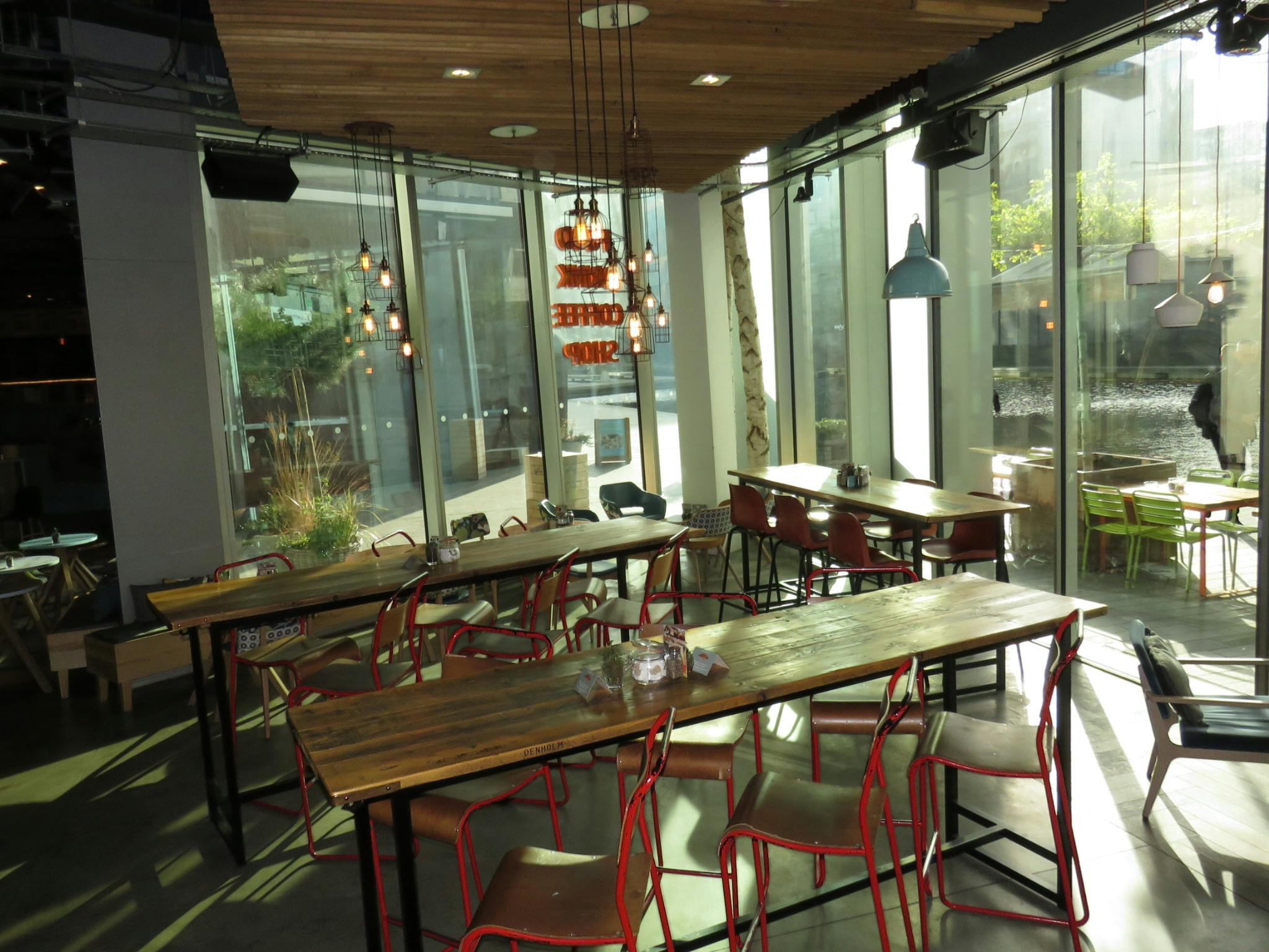 Modern event space at KuPP with large windows, perfect for networking and workshops.