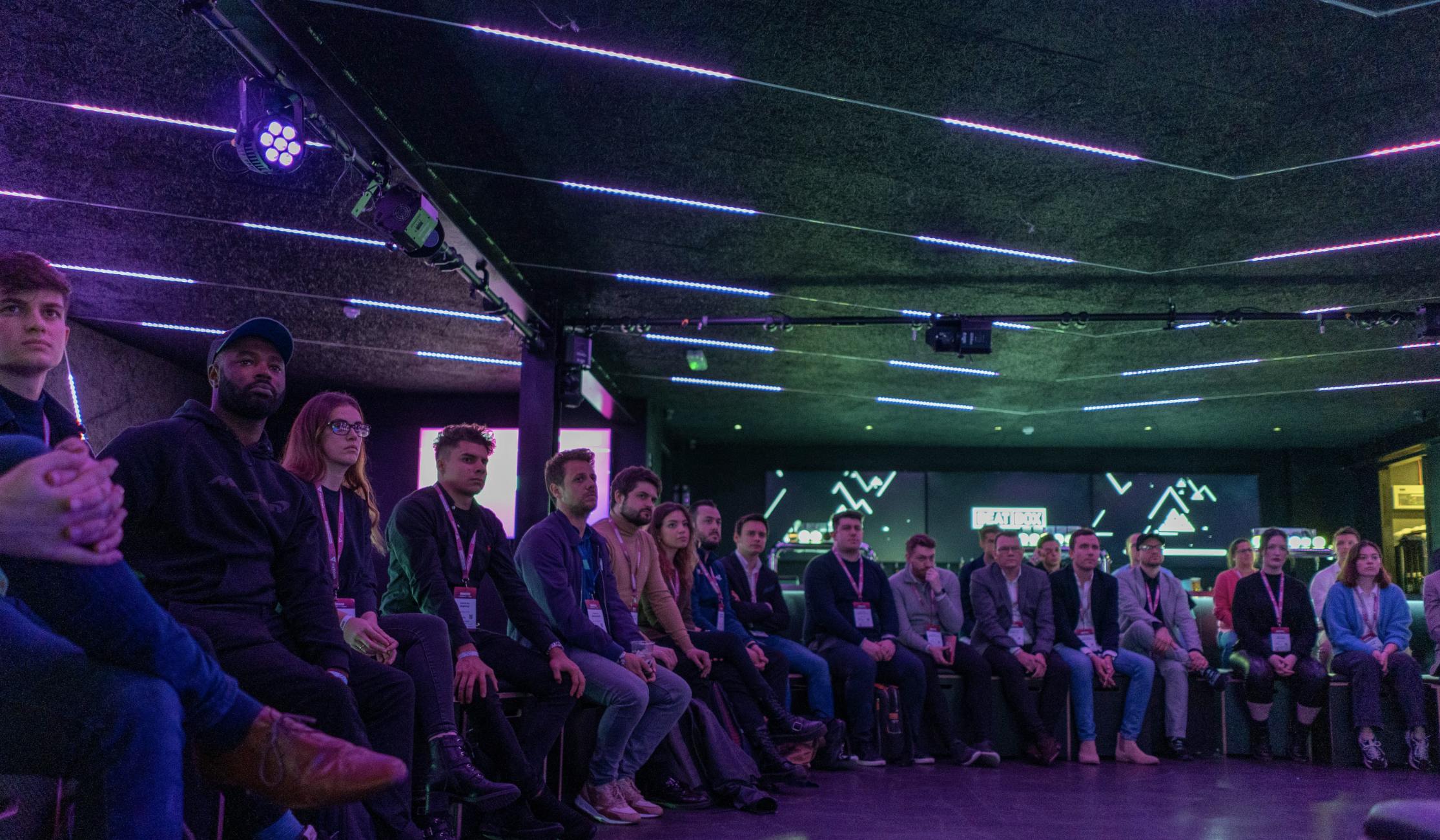 Panel discussion at BeatBox, Boxpark Wembley with engaged audience in modern venue.