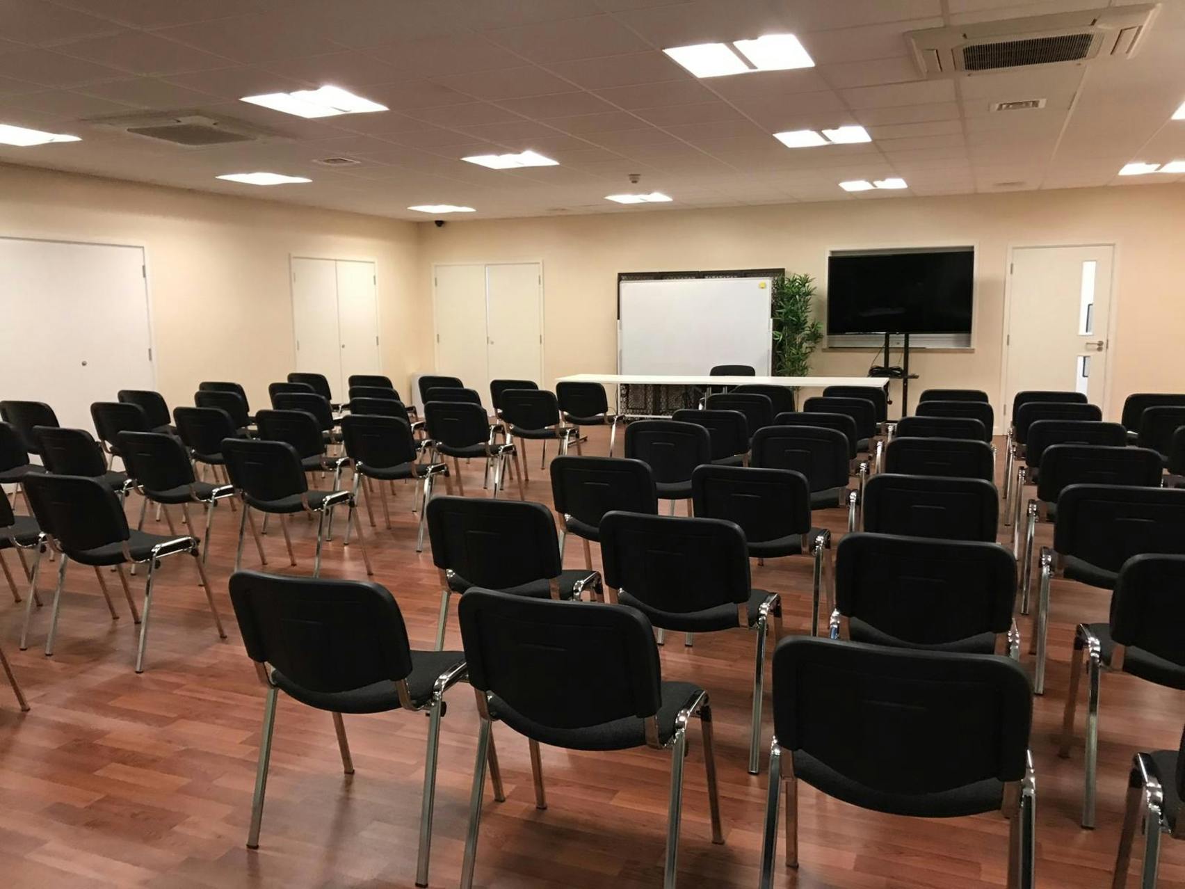 Whole Venue in Whitechapel, London: organized meeting space with black chairs for workshops.