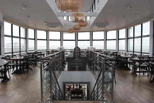 Modern Brighton Beach Club restaurant with panoramic windows, ideal for events and dining.