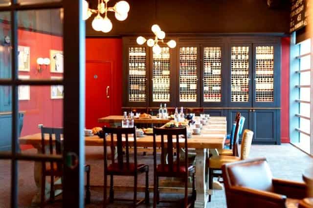 Stylish meeting room with wooden table, ideal for corporate gatherings at The Bull Westfield.