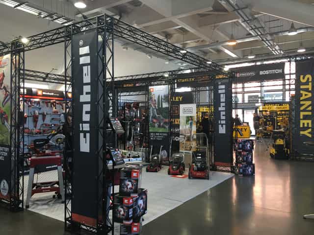Trade show booth at Newbury Racecourse featuring Einhell and Stanley tools.