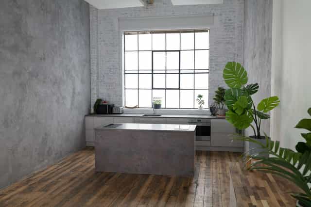 Modern minimalist kitchen with natural light, perfect for wellness events and cooking classes.