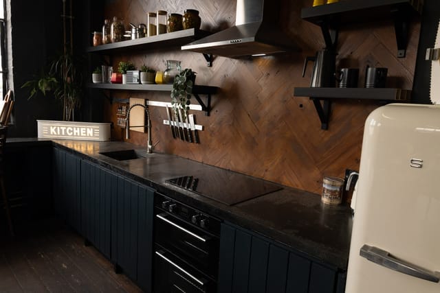 Modern kitchen with wood accents, perfect for culinary events and gatherings.