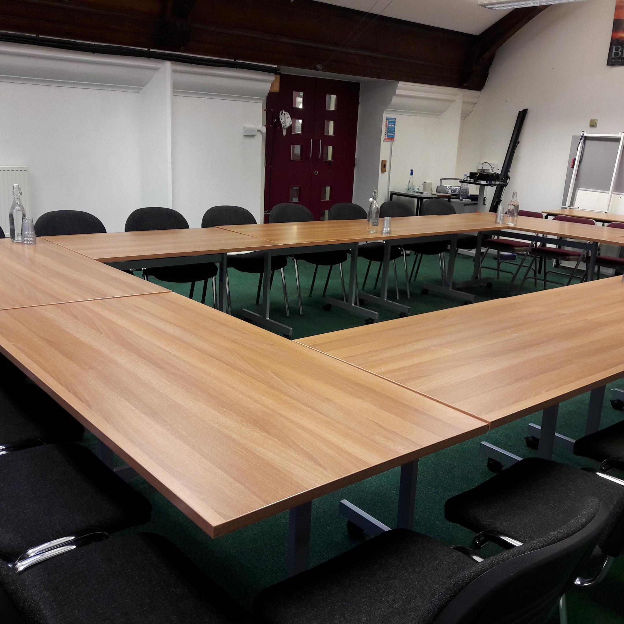 Trestle Theatre's Drama Studio with U-shaped tables for collaborative meetings.