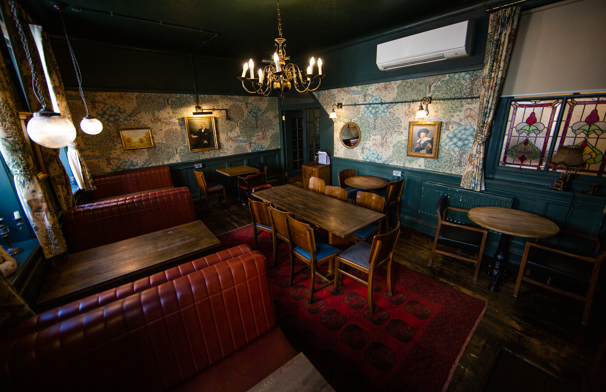 Cozy meeting space in Bow Street Tavern with vintage decor, perfect for intimate gatherings.