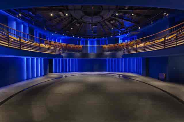 Modern circular auditorium with tiered seating for events and presentations.