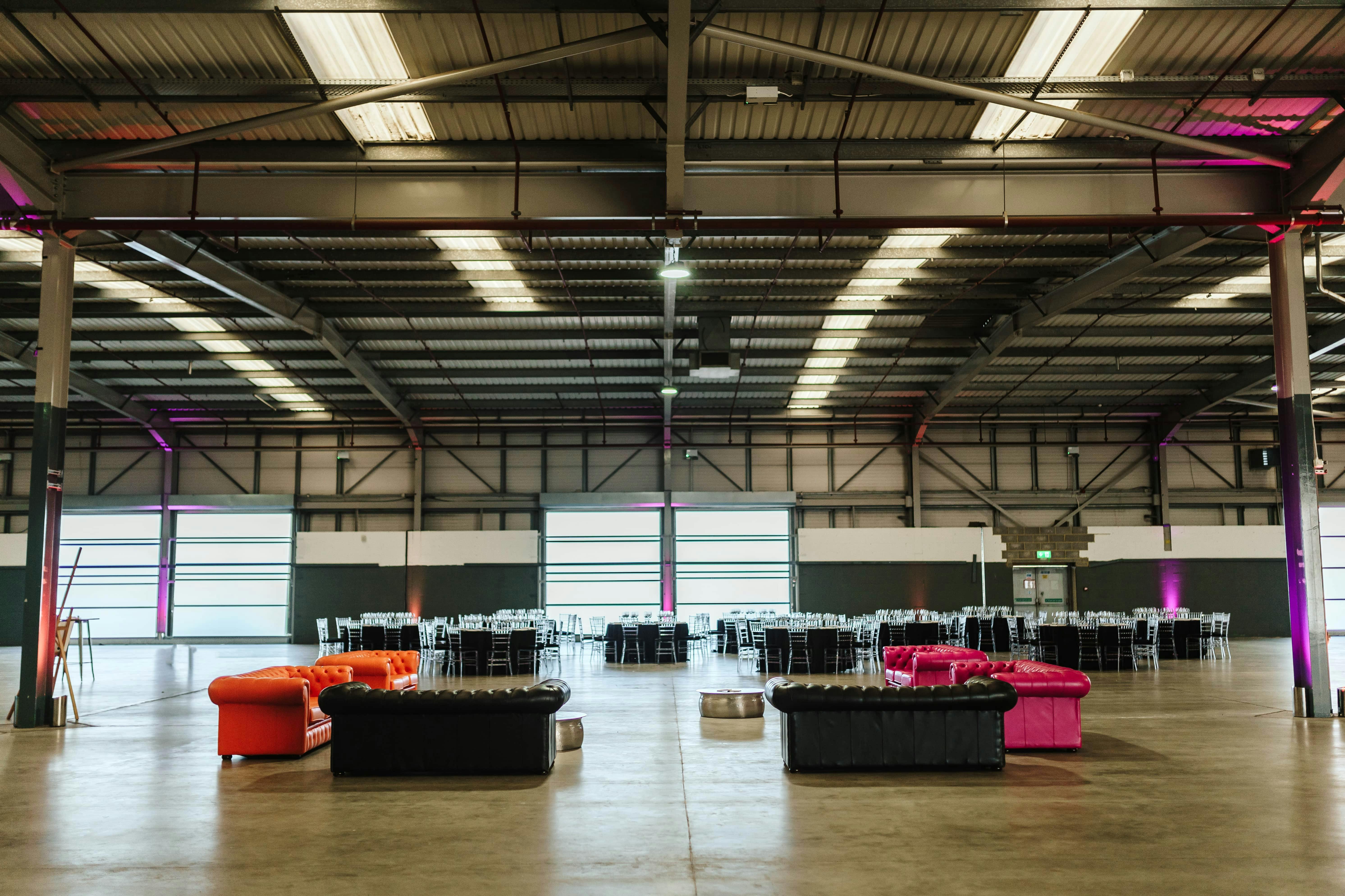 Spacious Dock X London venue with vibrant seating for corporate and social events.